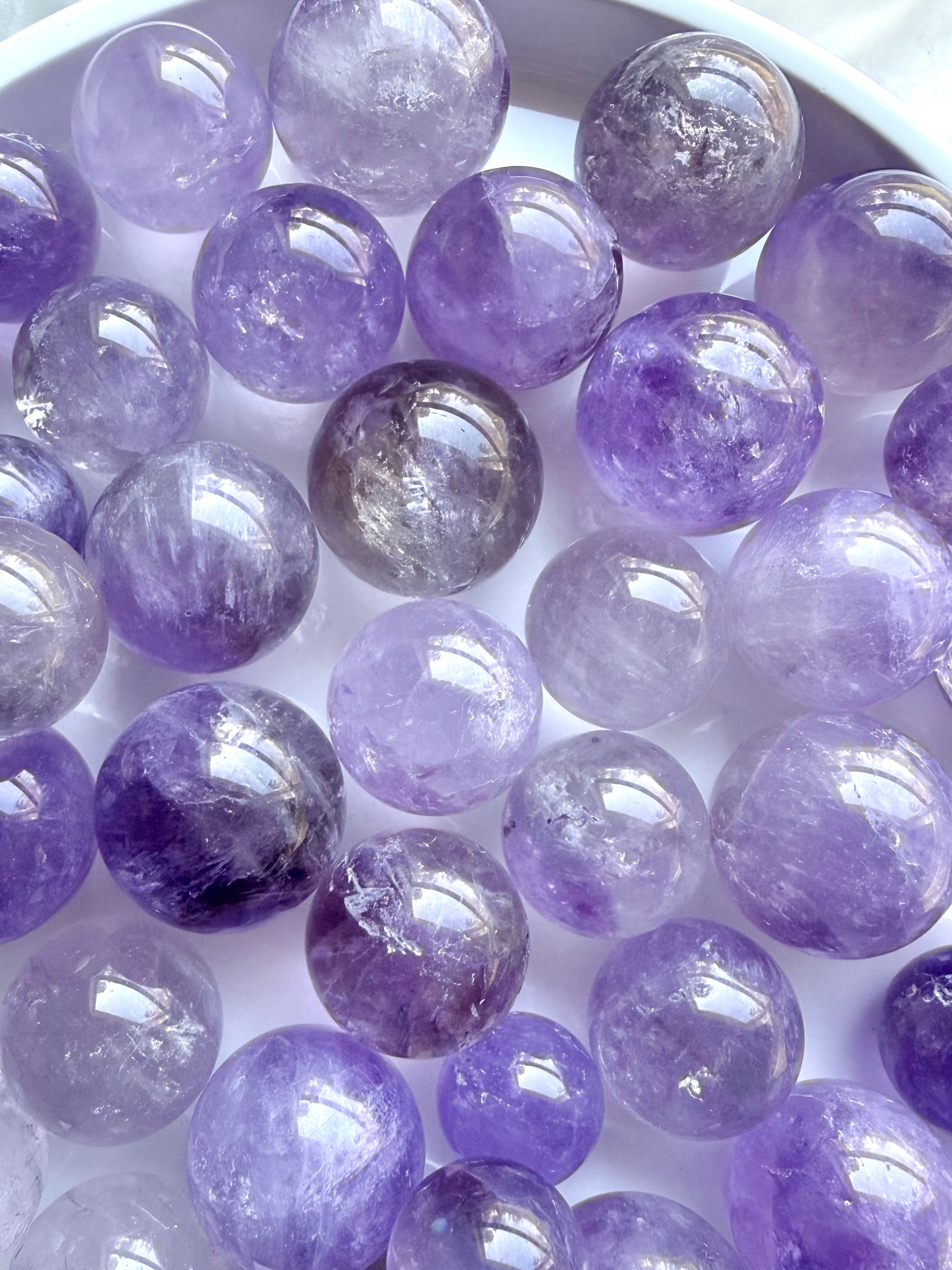 smoky amethyst mini spheres small crystal balls in lilac and purple tones polished gemstone spheres for meditation and decor