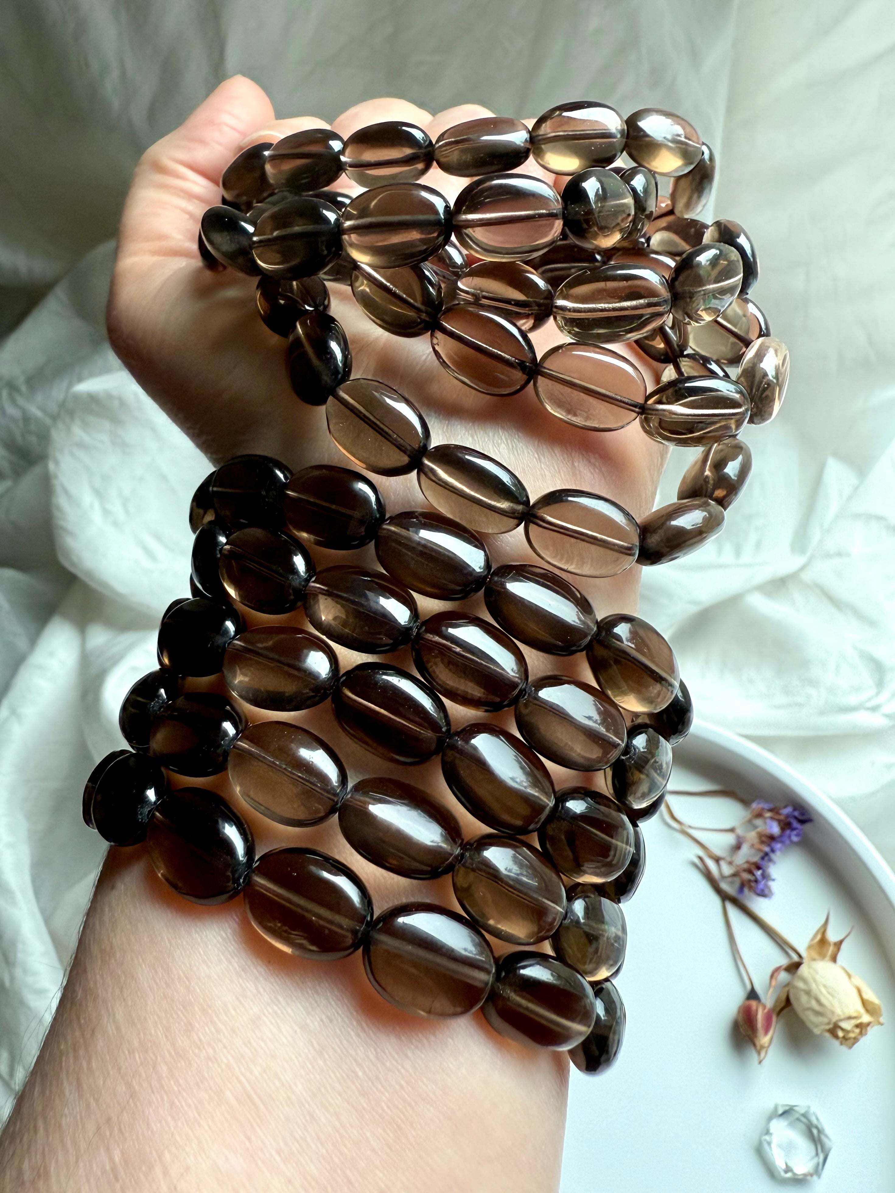 Polished Smoky Quartz oval bead bracelets stacked on wrist – crystal bracelets for protection and balance