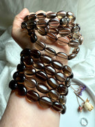 Polished Smoky Quartz oval bead bracelets stacked on wrist – crystal bracelets for protection and balance