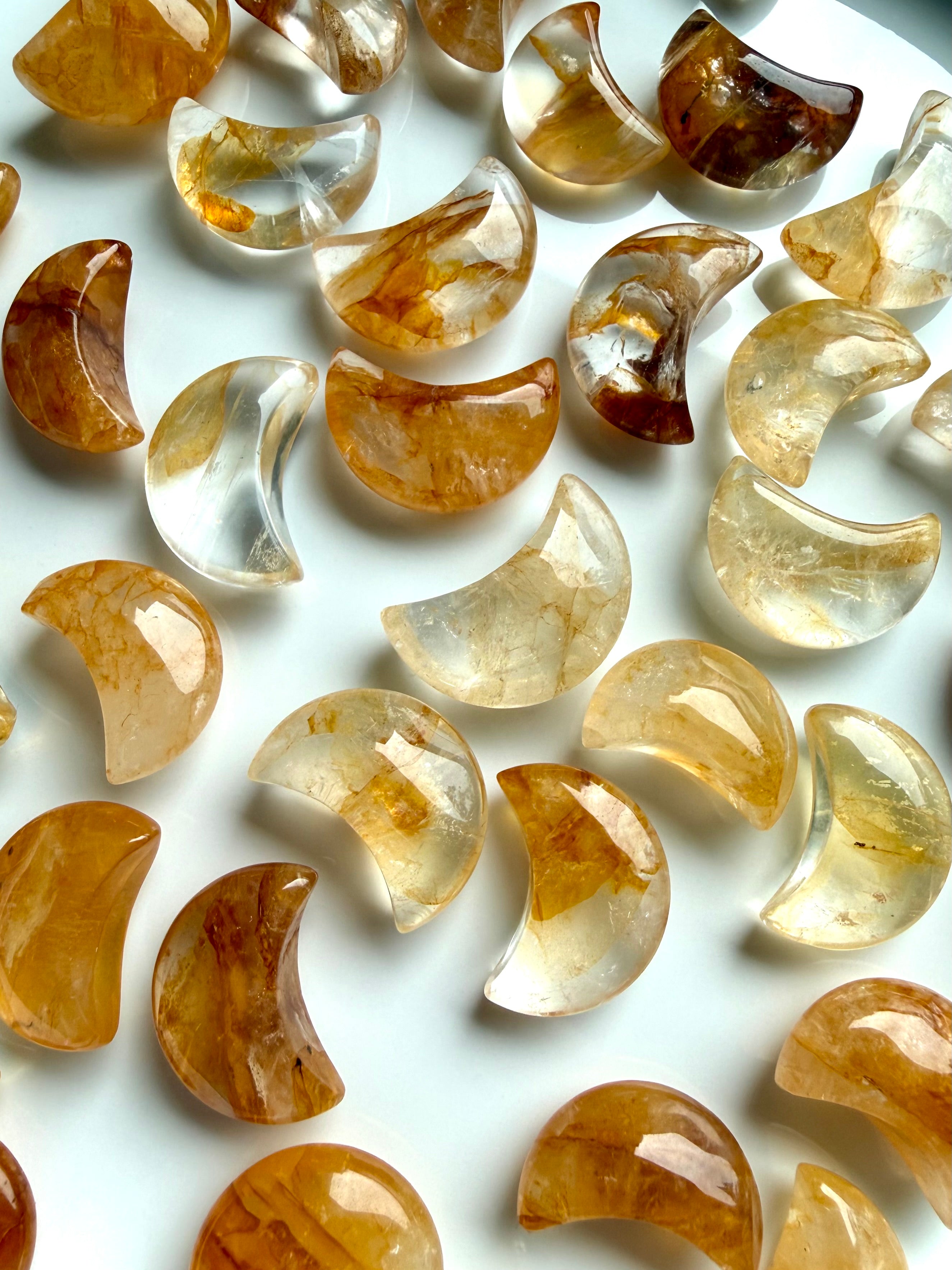 Golden Healer Quartz mini moons with natural golden patterns and crystal carving details