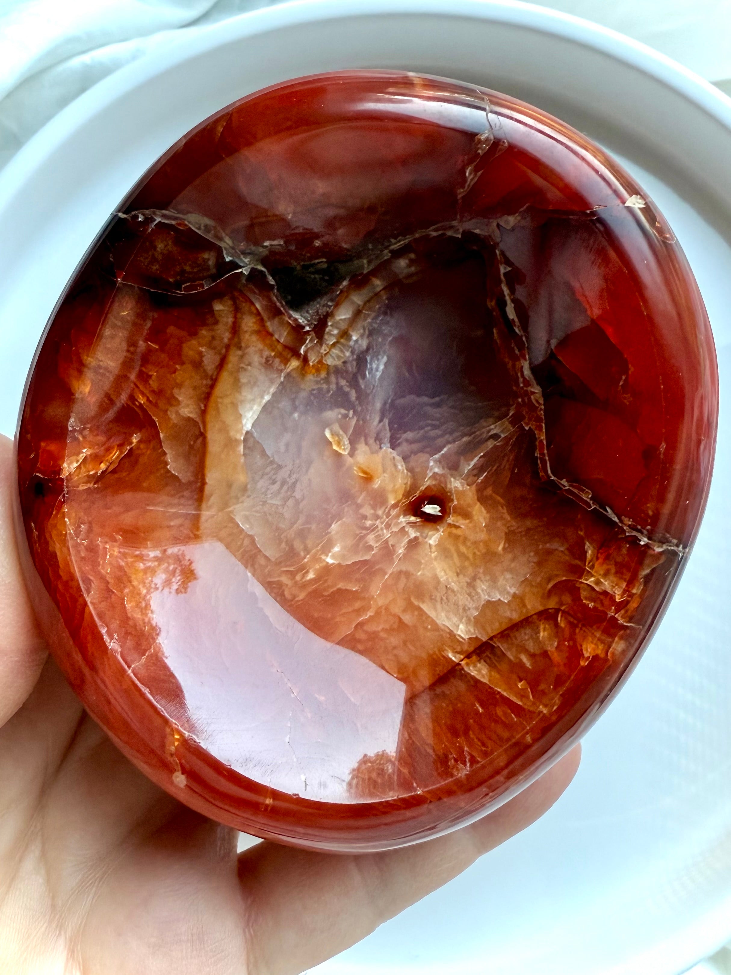 Macro detail of Carnelian bowl interior – a sacral chakra stone with grounding and energizing energy