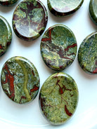 Polished Dragon Blood Stone thumb stones with distinctive green and red mineral formations for grounding and protection