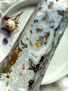 Close-up of Cosmic Ocean Jasper tower showing intricate chalcedony banding, earthy inclusions, and natural druzy pockets