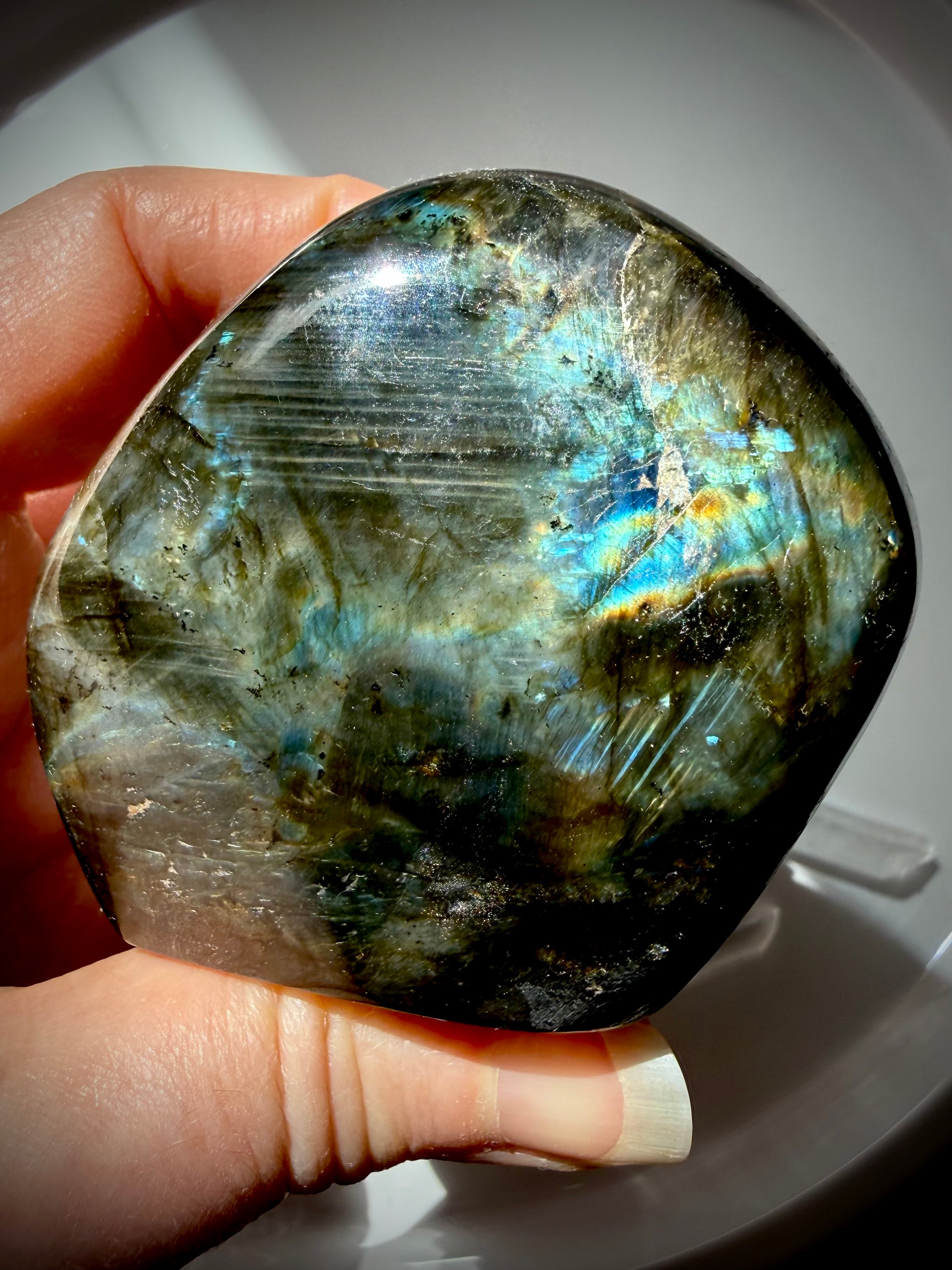 Back of Rainbow Labradorite freeform showing natural gray-green matrix and subtle blue and gold flash