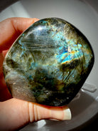 Back of Rainbow Labradorite freeform showing natural gray-green matrix and subtle blue and gold flash