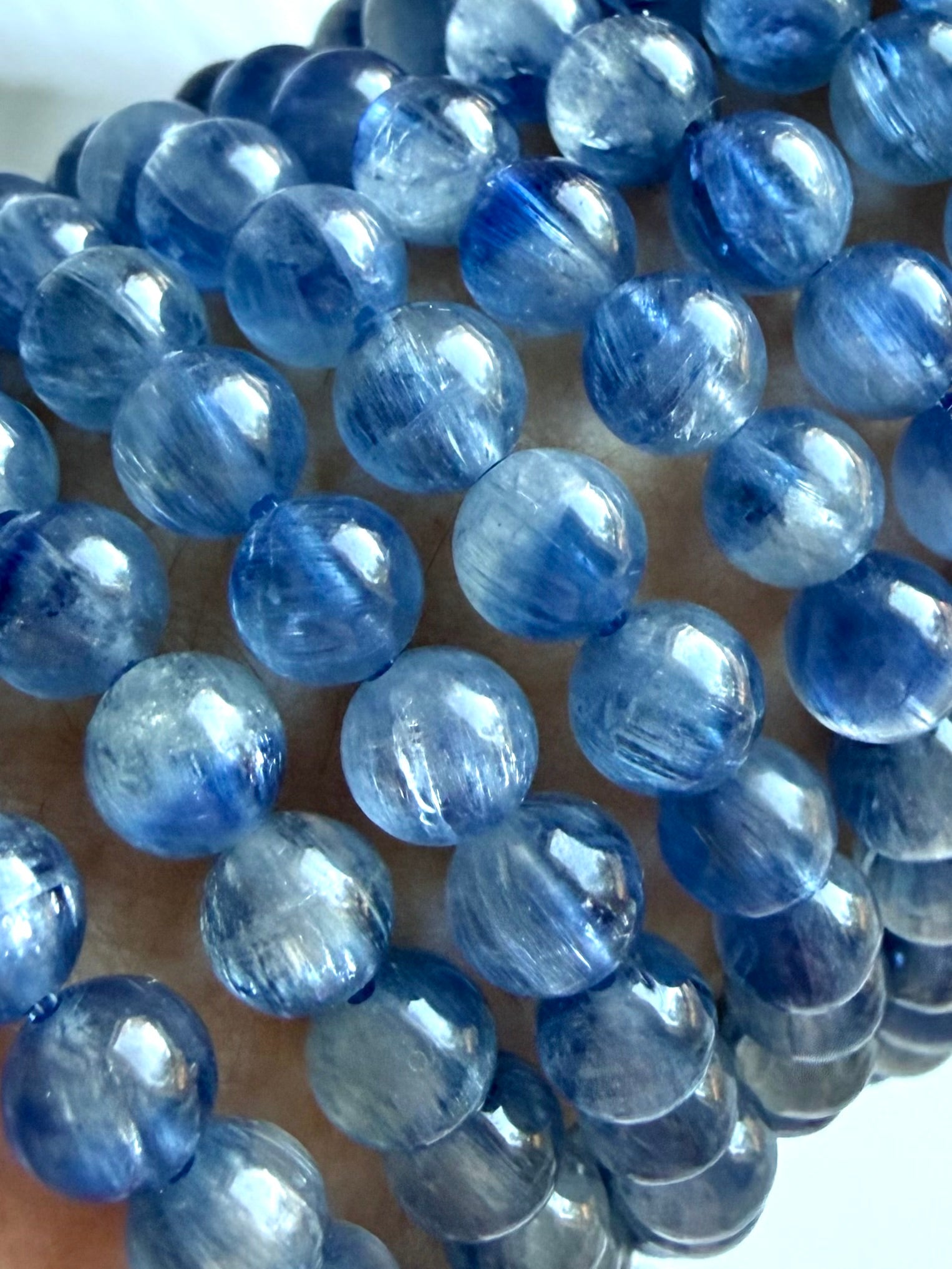 Close-up of Blue Kyanite crystal bracelet showing two-tone blue gemstones and silky crystalline depth