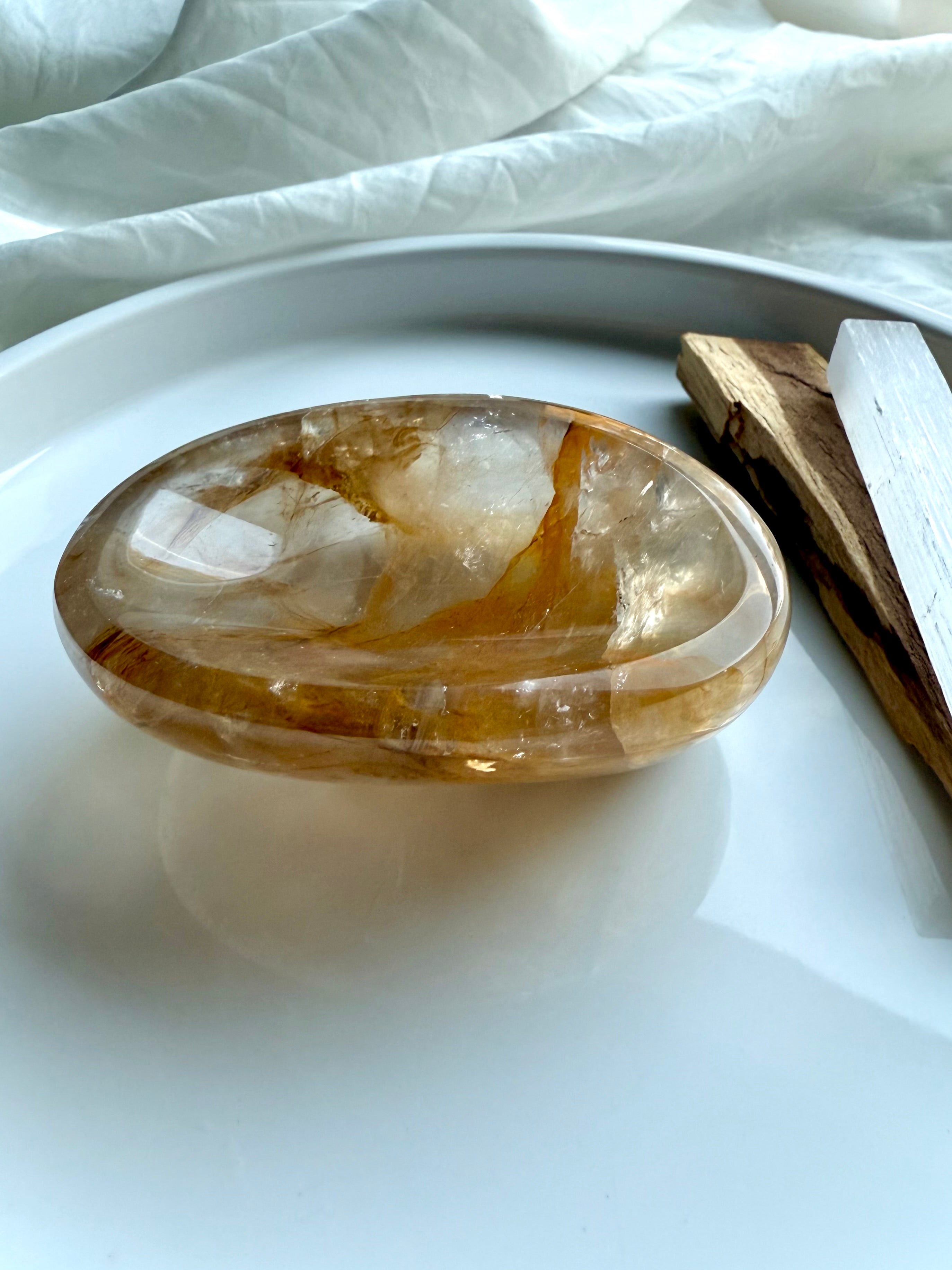 Golden Healer Quartz crystal bowl styled on altar with palo santo, small healing dish for sacred space decor