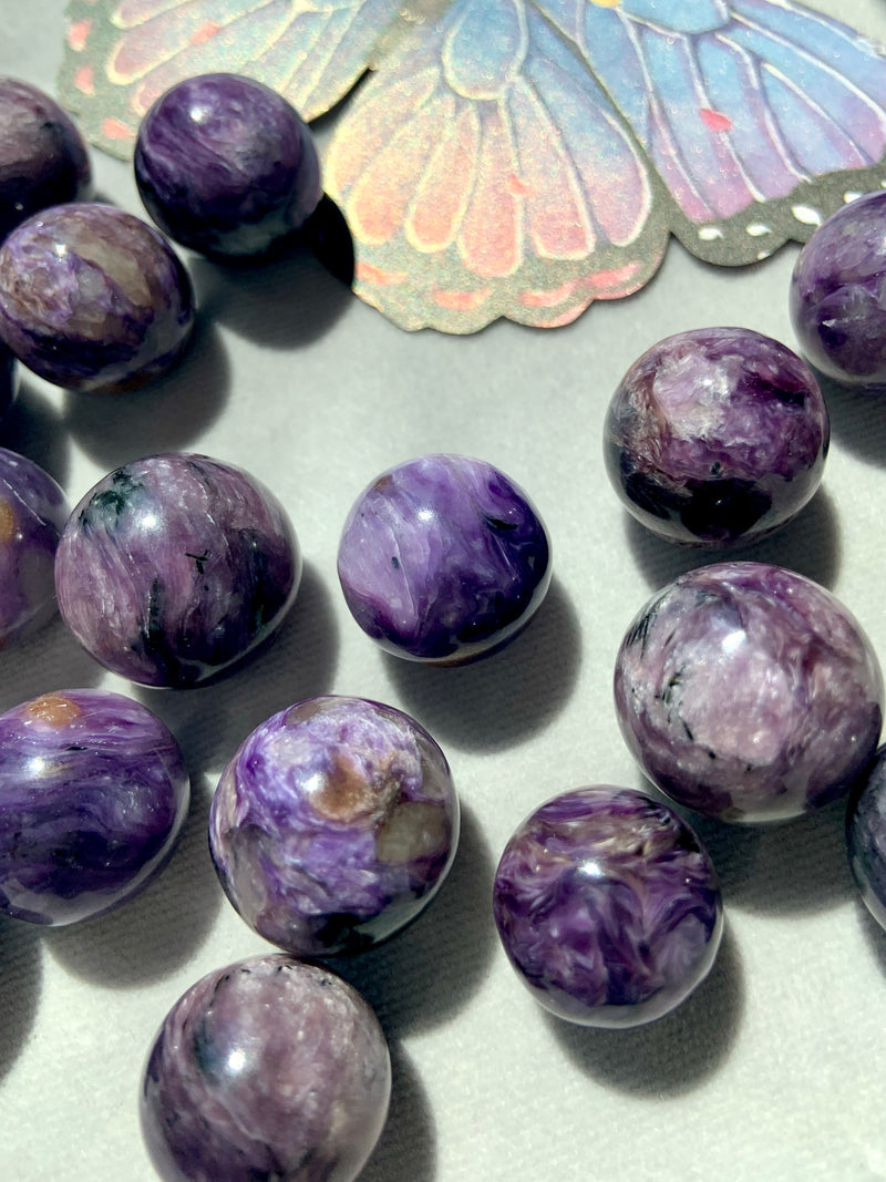 Charoite spheres with a lovely color range from pale lilac to saturated purple to deep purple