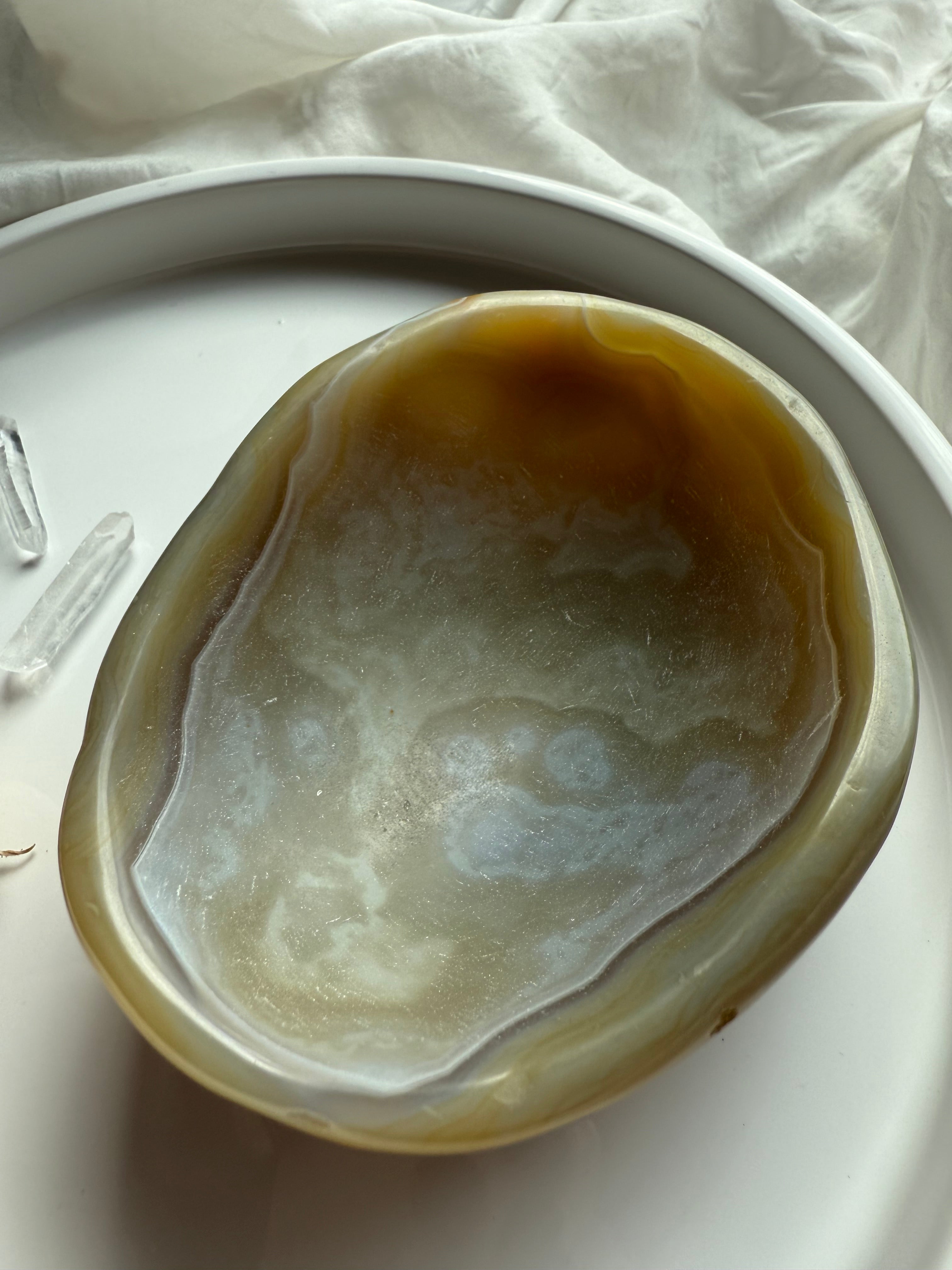 Beige Agate gemstone bowl in natural light – crystal offering dish for grounding rituals