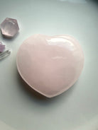 Mangano Calcite heart meditation stone with soft pink translucency and polished finish from Pakistan