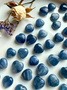 Assorted mini Blue Kyanite crystal hearts in various sizes with natural variation in color, shimmer and inclusions