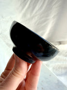 Side view of Black Obsidian crystal bowl showing rounded shape and glossy finish