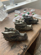 Hand-carved pyrite crystal dragons with natural metallic shimmer, symbolic guardians for wealth and confidence
