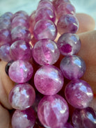 Close-up of Pink Tourmaline gemstone beads with beautiful translucency, internal patterns, and watercolor-like pink tones