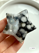 black flower agate star carving #1 back showing natural agate variation and soft bloom inclusions