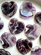 dream amethyst heart crystals arranged together for intuition clarity and emotional balance