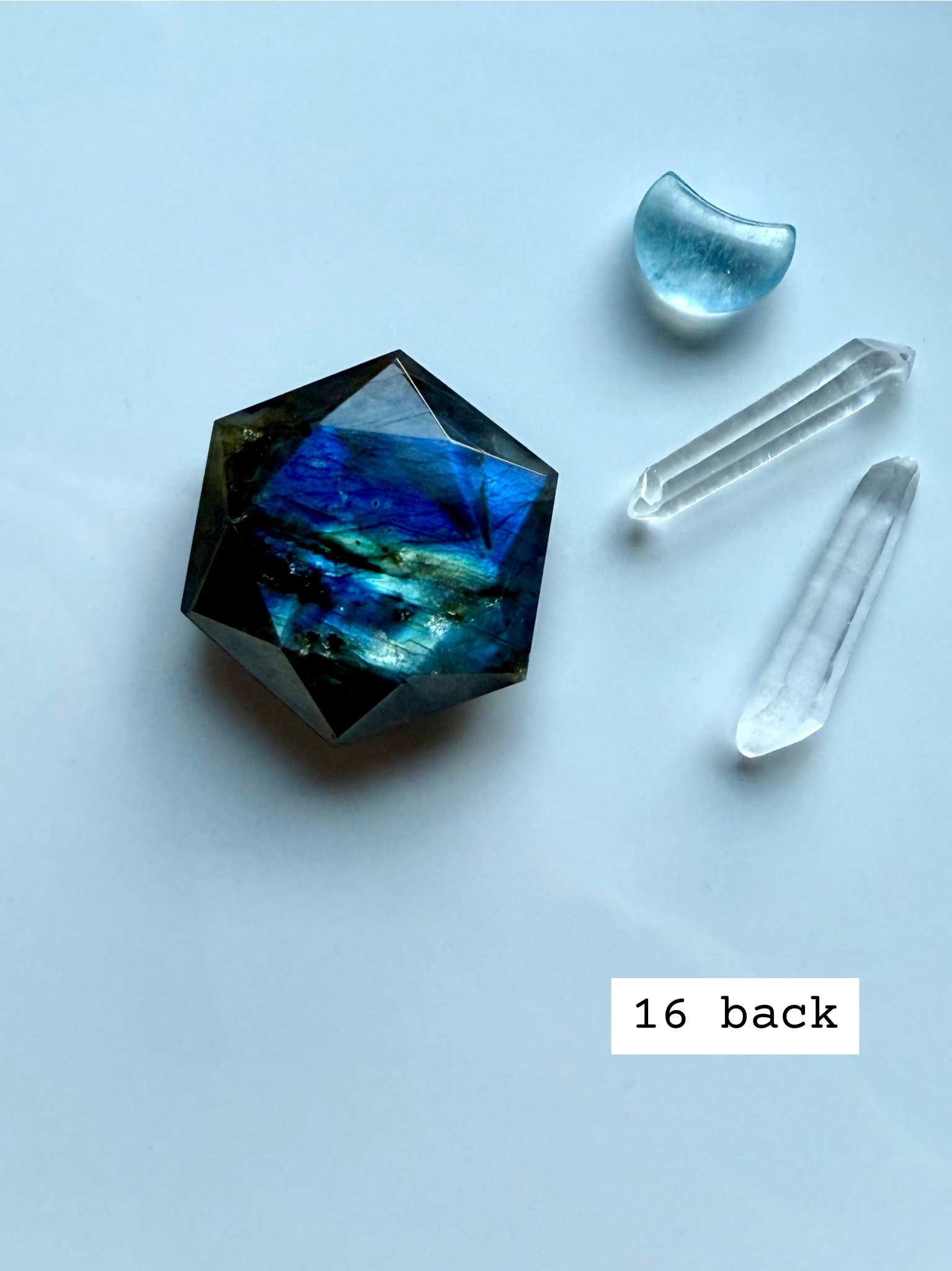 faceted labradorite hexagon with deep blue green flash styled with quartz points labradorite star of david carving for third eye chakra