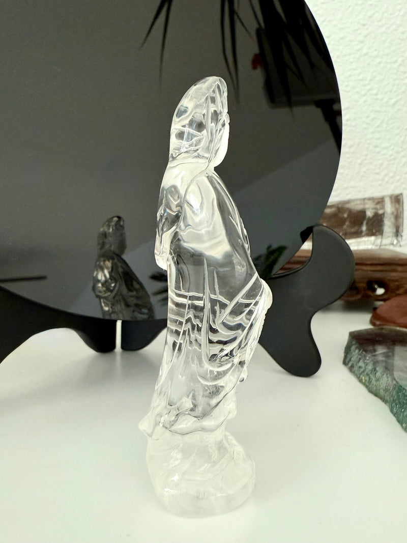 A crystal Quan Yin carving to elevate your sacred space made from Clear Quartz Crystal