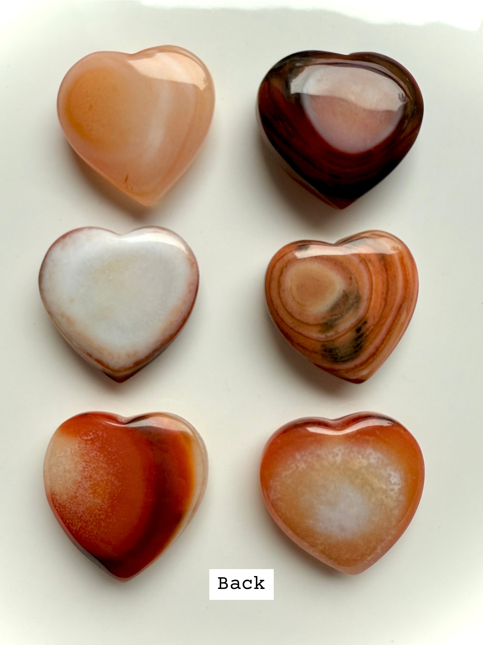 Back view of Mini Carnelian Heart revealing natural banding and unique stone patterns