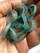 Premium Blue Water Jade woven bands in hand with natural marbling, luminous depth, and exceptional light transmission