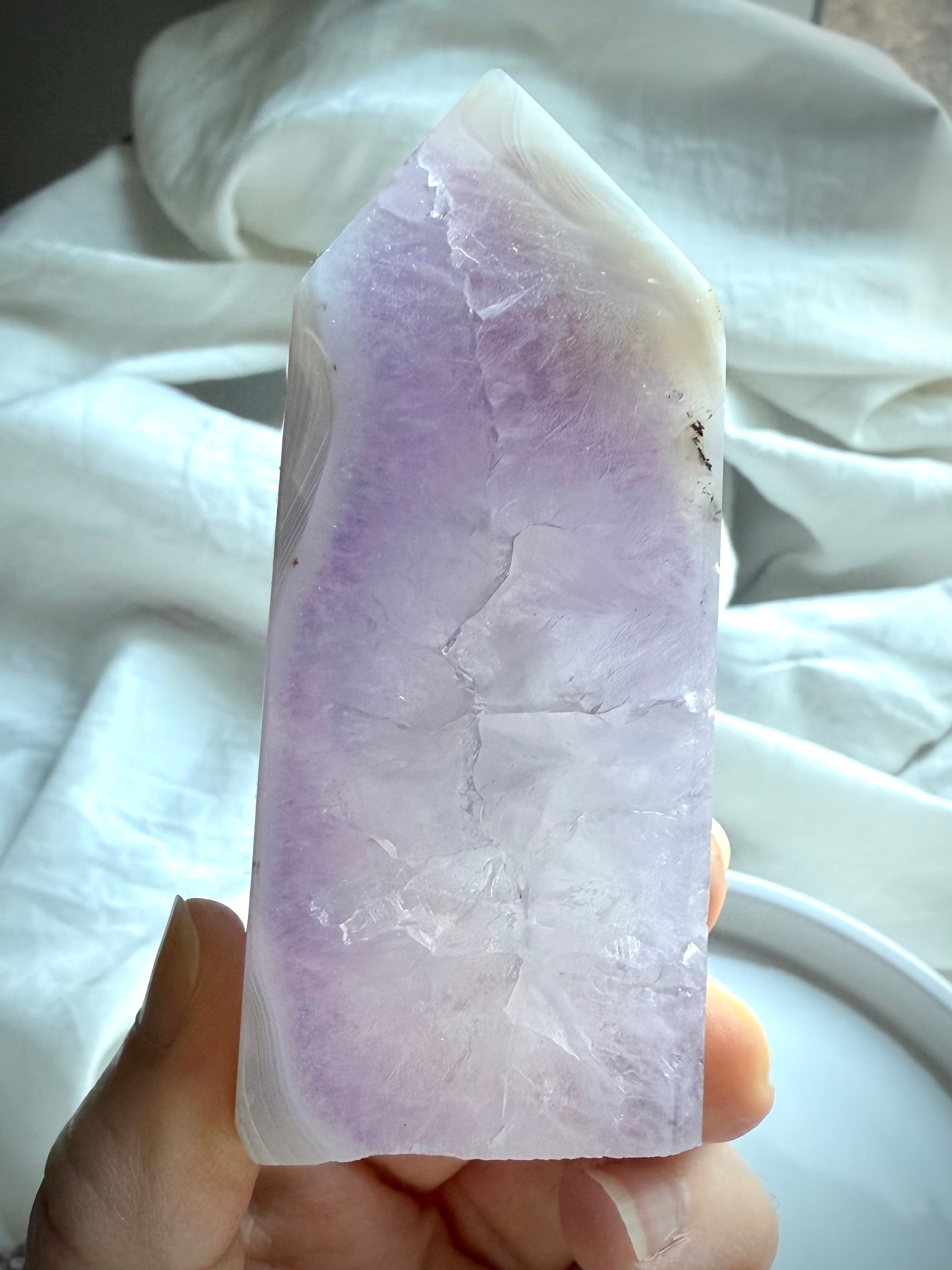 Back view of Amethyst Geode Tower revealing purple crystal structure and soft banding