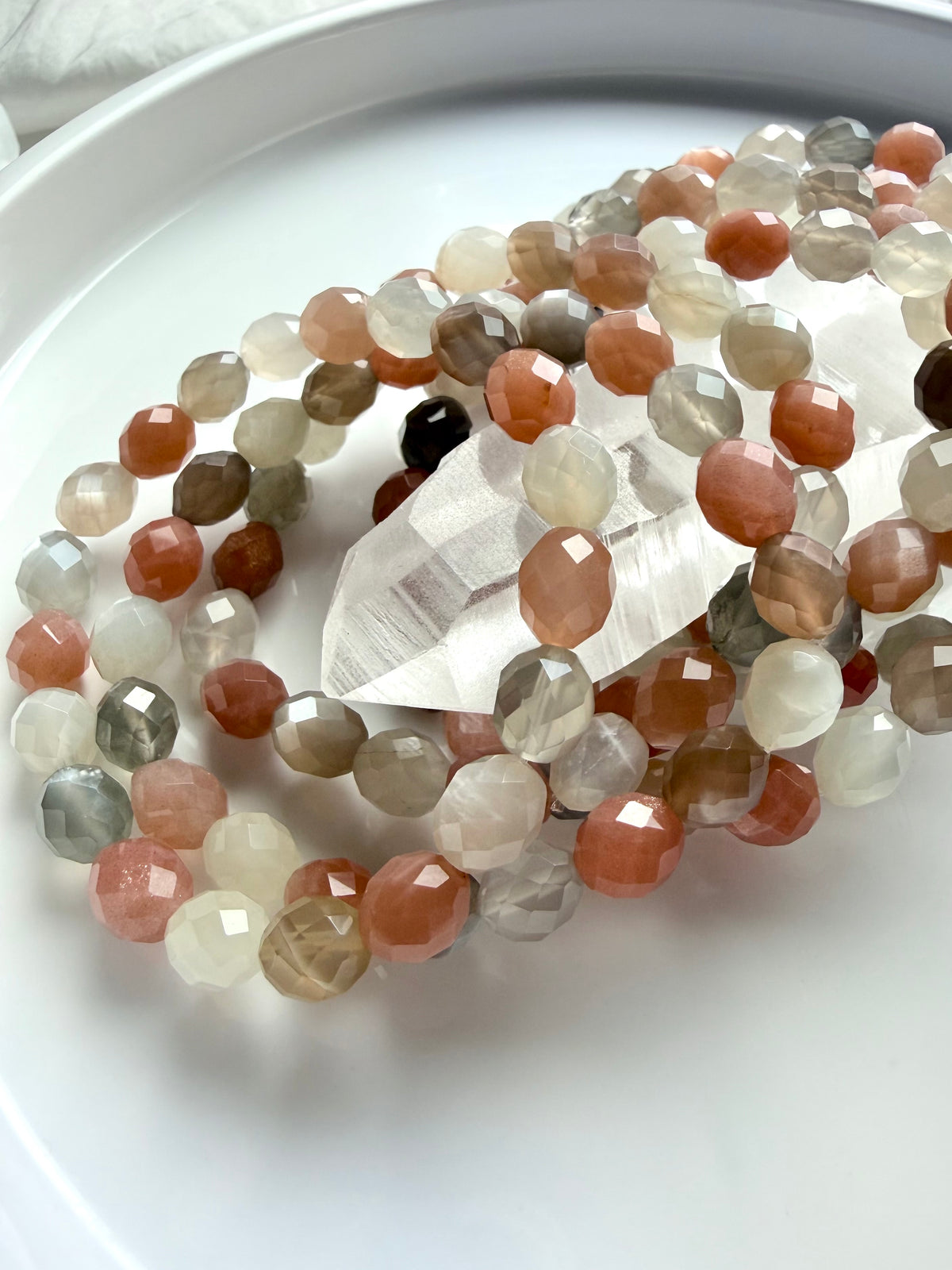 Faceted Moonstone bracelets with natural gemstone shimmer and warm peach, smoky gray, and creamy white beads