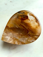 Teardrop Golden Healer Quartz bowl top view showing honey tones and natural dendritic crystal pattern