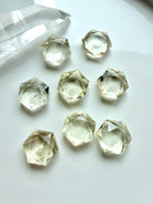 Mini Citrine hexagons with precision-cut facets, clear champagne-gold color, and light-catching internal patterns