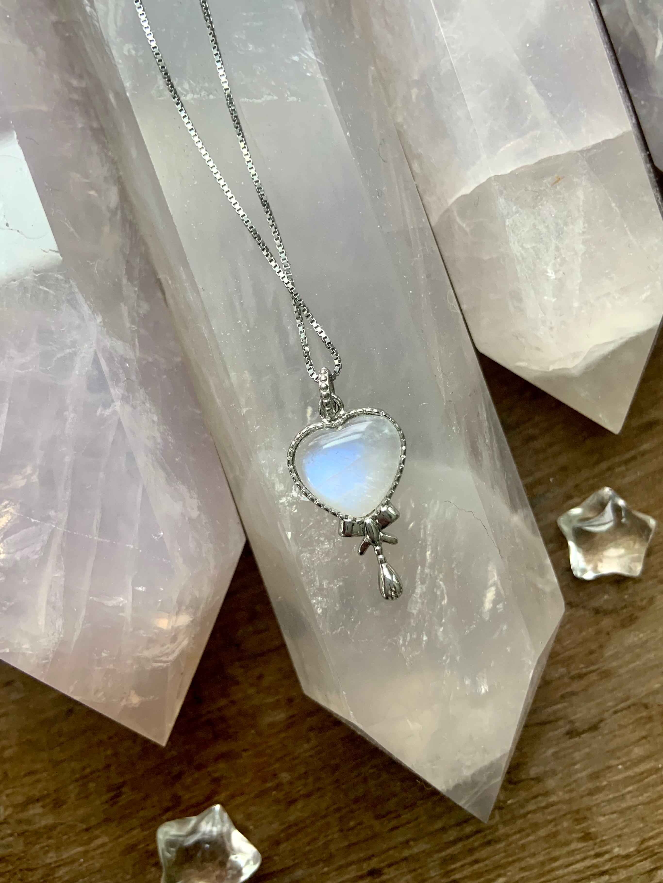 Sterling silver and moonstone crystal heart pendants for comfort and healing