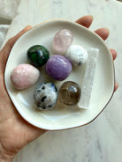 Grief support crystal set with Rose Quartz, Amethyst, Moonstone, Howlite, Smoky Quartz, and Selenite in a gold rim ceramic bowl