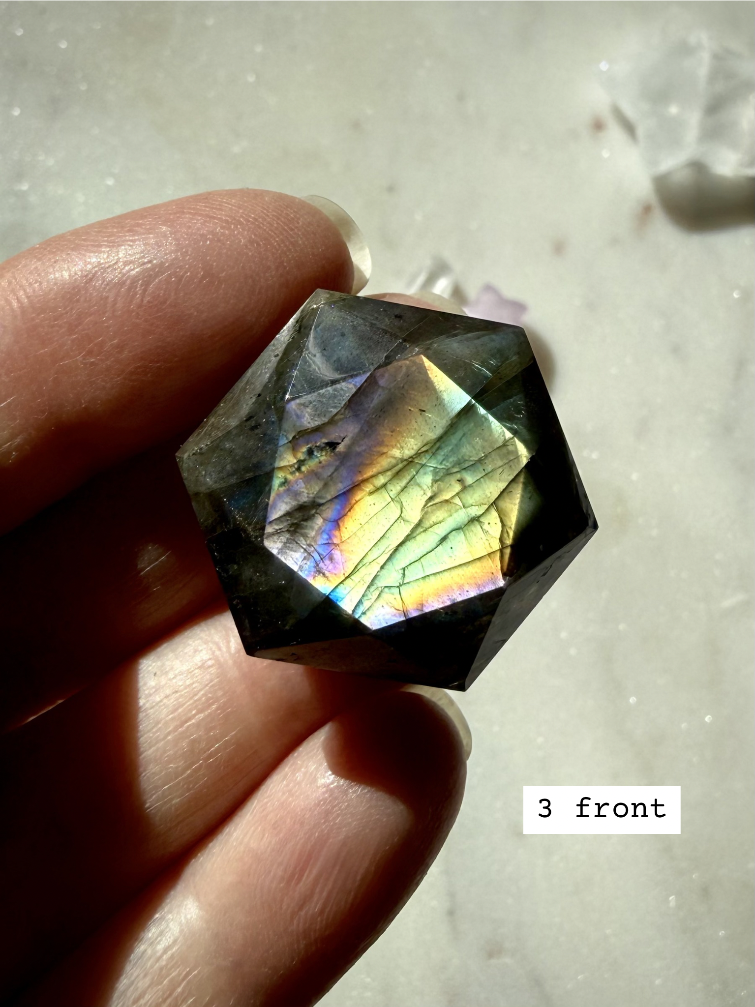 Rainbow flash Labradorite hexagon – sacred geometry crystal for Third Eye Chakra, with multicolored labradorescence, front view