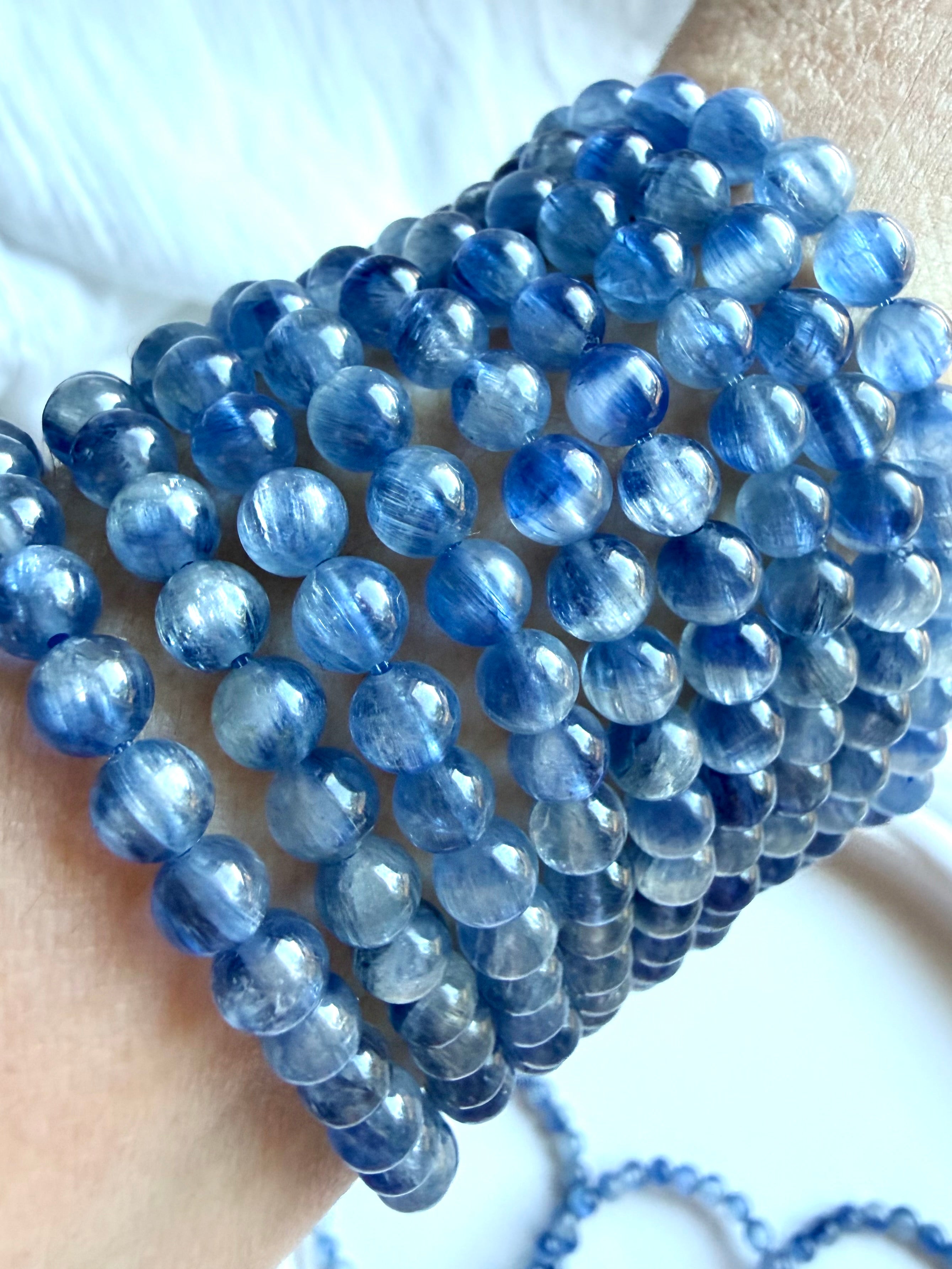 Collection of Blue Kyanite bracelets in layered shades of icy blue, cornflower, and sapphire