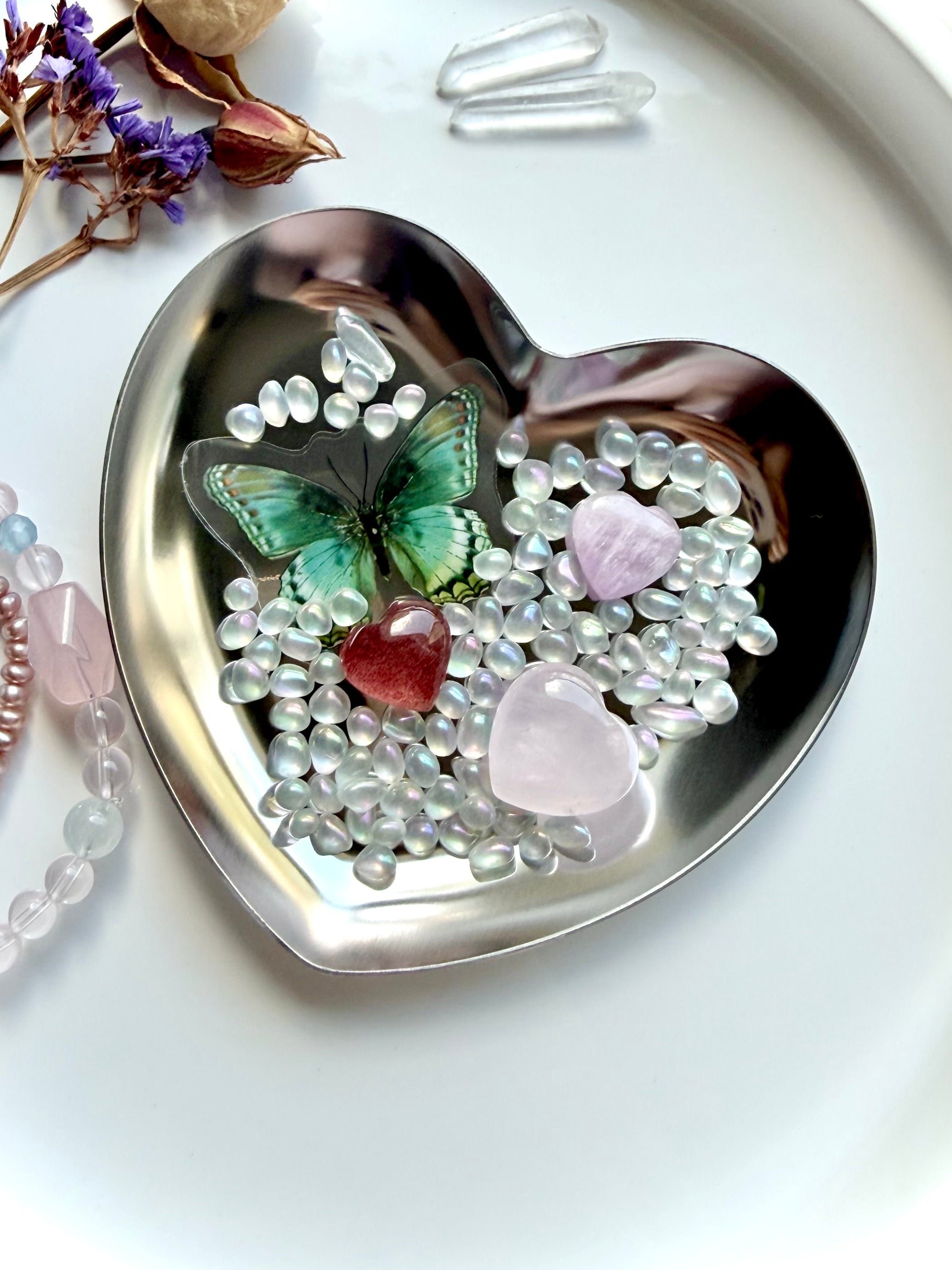Mini crystal heart gift set with rose quartz, strawberry quartz, and kunzite in a gold heart bowl with aura crystal confetti and butterfly detail
