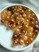 overhead view of golden healer quartz mini spheres for solar plexus chakra healing and energy work