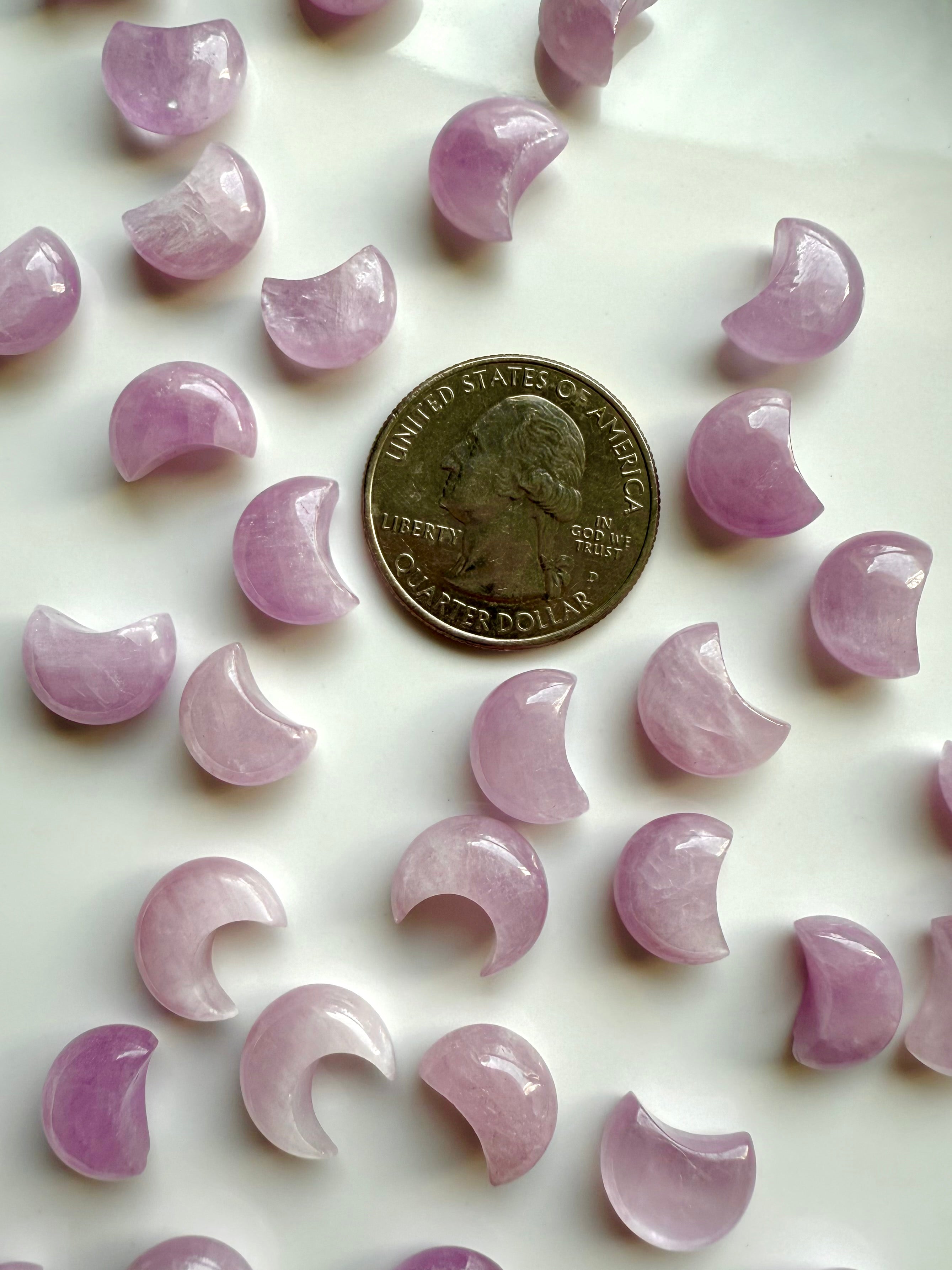 Mini Pink Kunzite moon carvings with a quarter for scale — sweet crystal keepsakes for heart healing, emotional release & sacred décor.