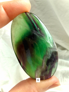 Rainbow Fluorite Palm Stone #6 with rich emerald green bands and subtle blue translucency