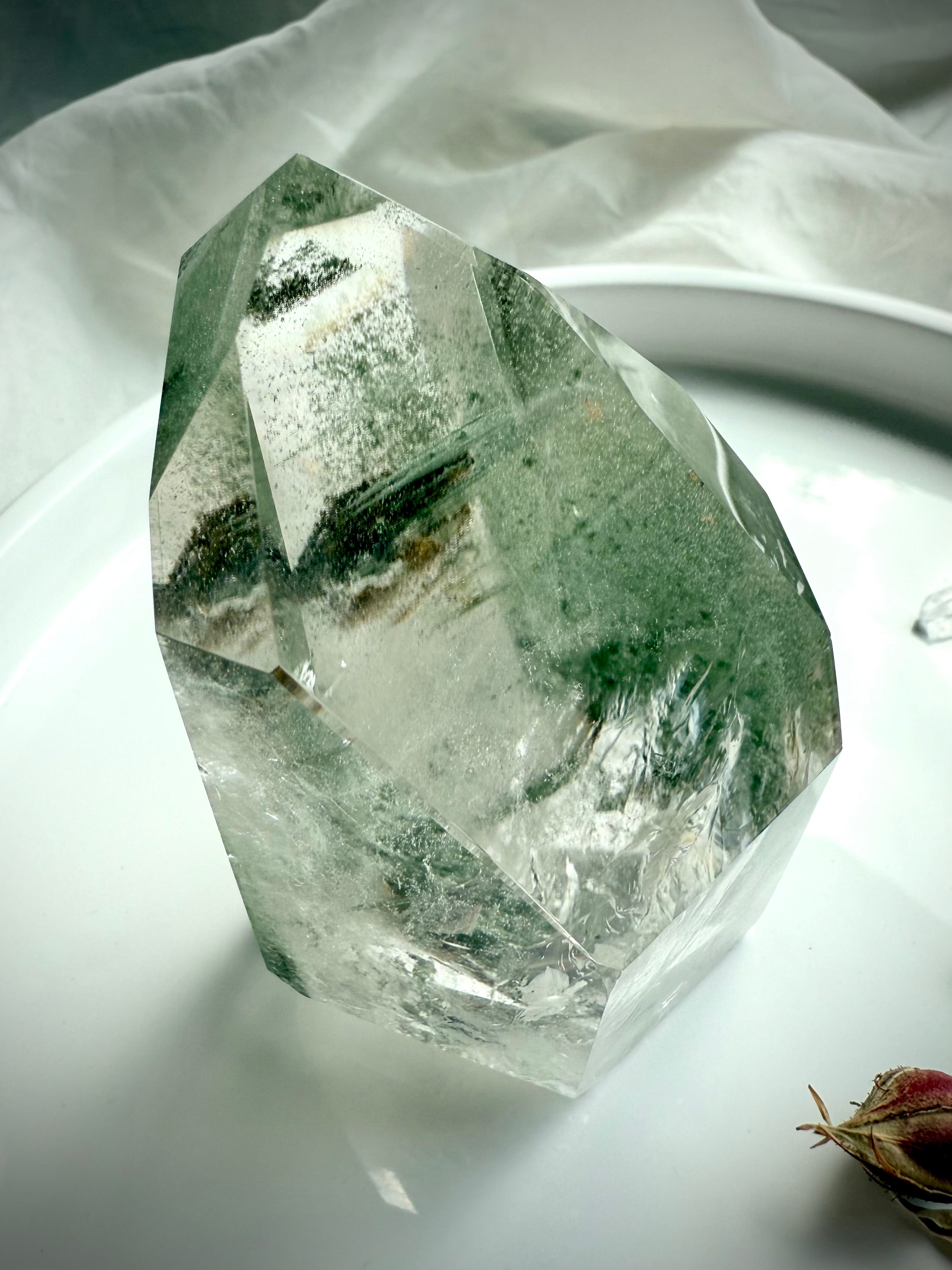 Lodolite crystal tower with lush green mineral formations and beautiful internal depth