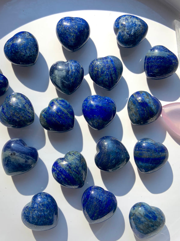 A close up view our mini sized, blue Lapis Lazuli Hearts with sparkling pyrite inclusions