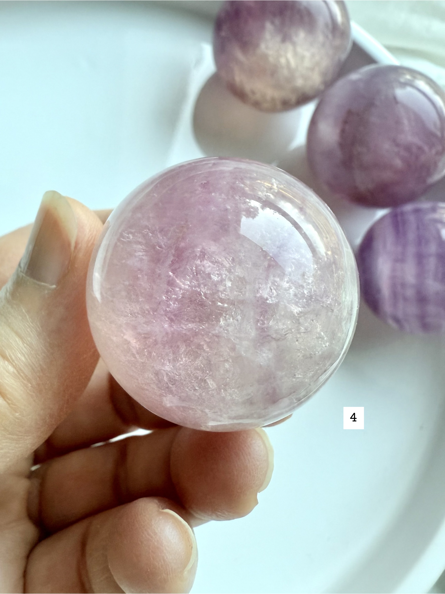 translucent Silky Magenta Fluorite sphere with soft pink and violet tones for heart and third eye chakras