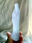 Lavender Fluorite Mother Mary figurine showing the serene prayer pose and softly translucent pastel crystal