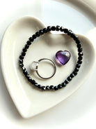 black spinel bracelet with crystal accents on dish for protection and energy clearing