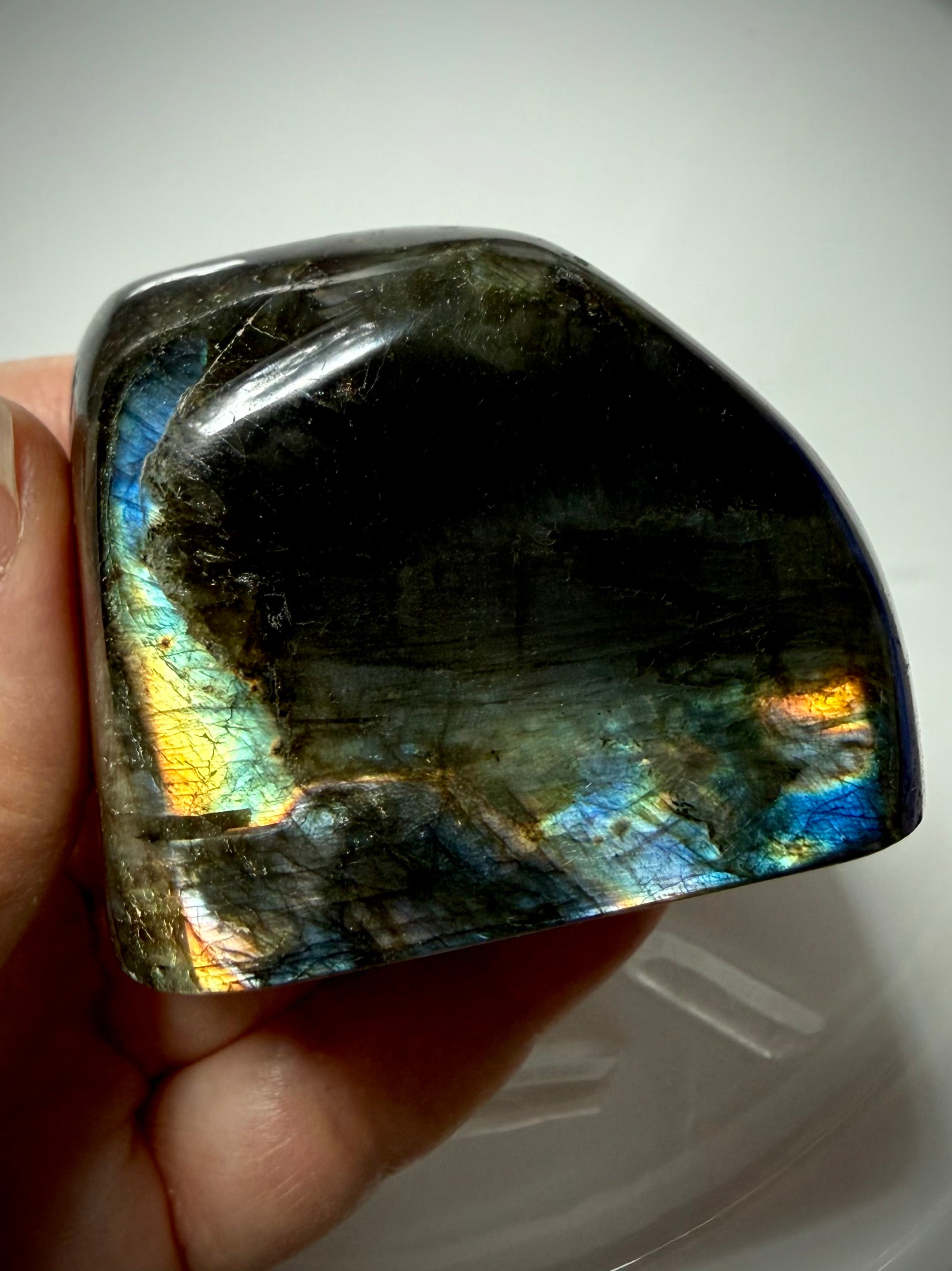 Polished Labradorite crystal with blue, gold and rainbow labradorescence, reverse side
