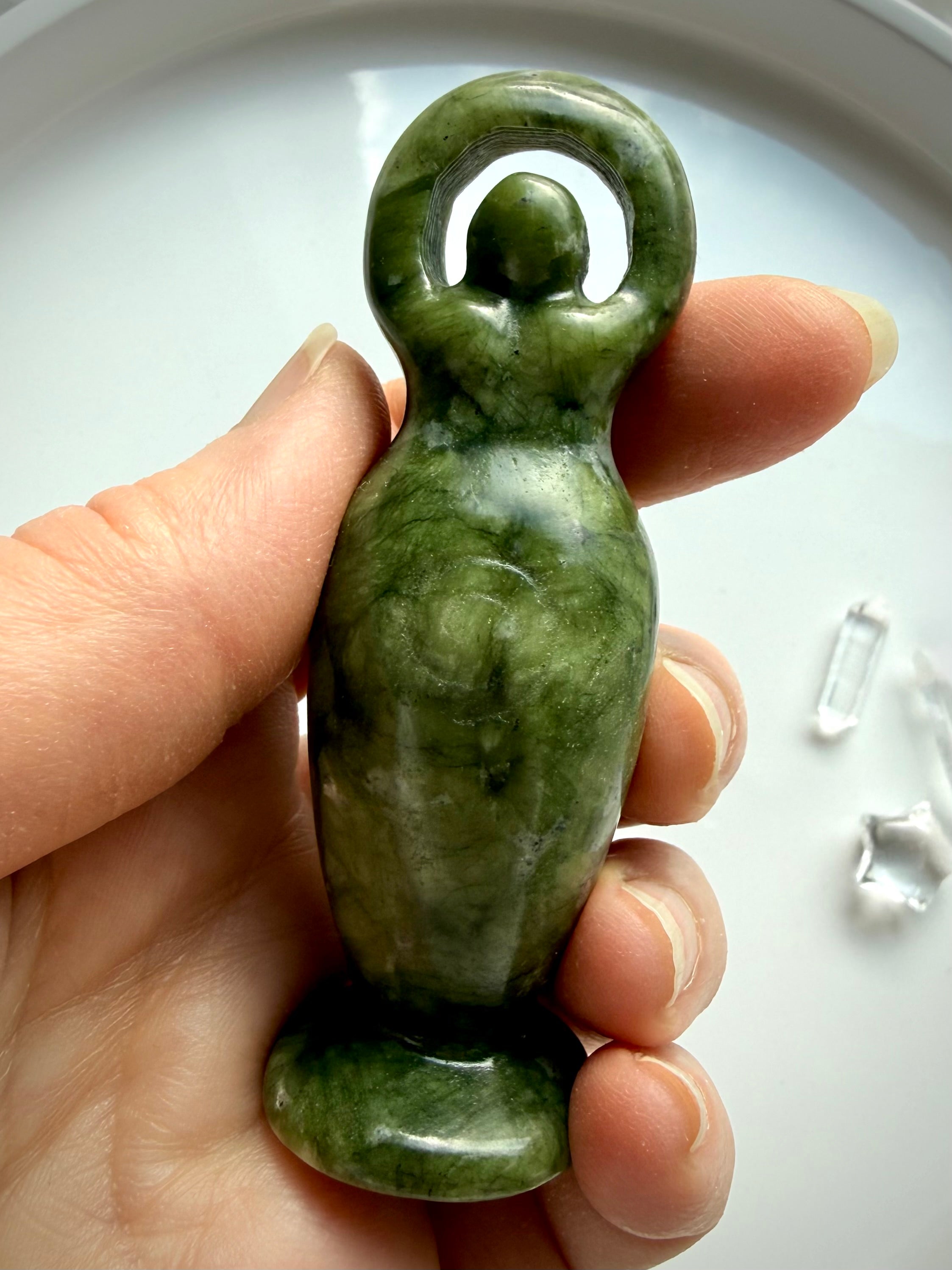 nephrite jade goddess figurine held in hand green jade crystal carving for protection and balance