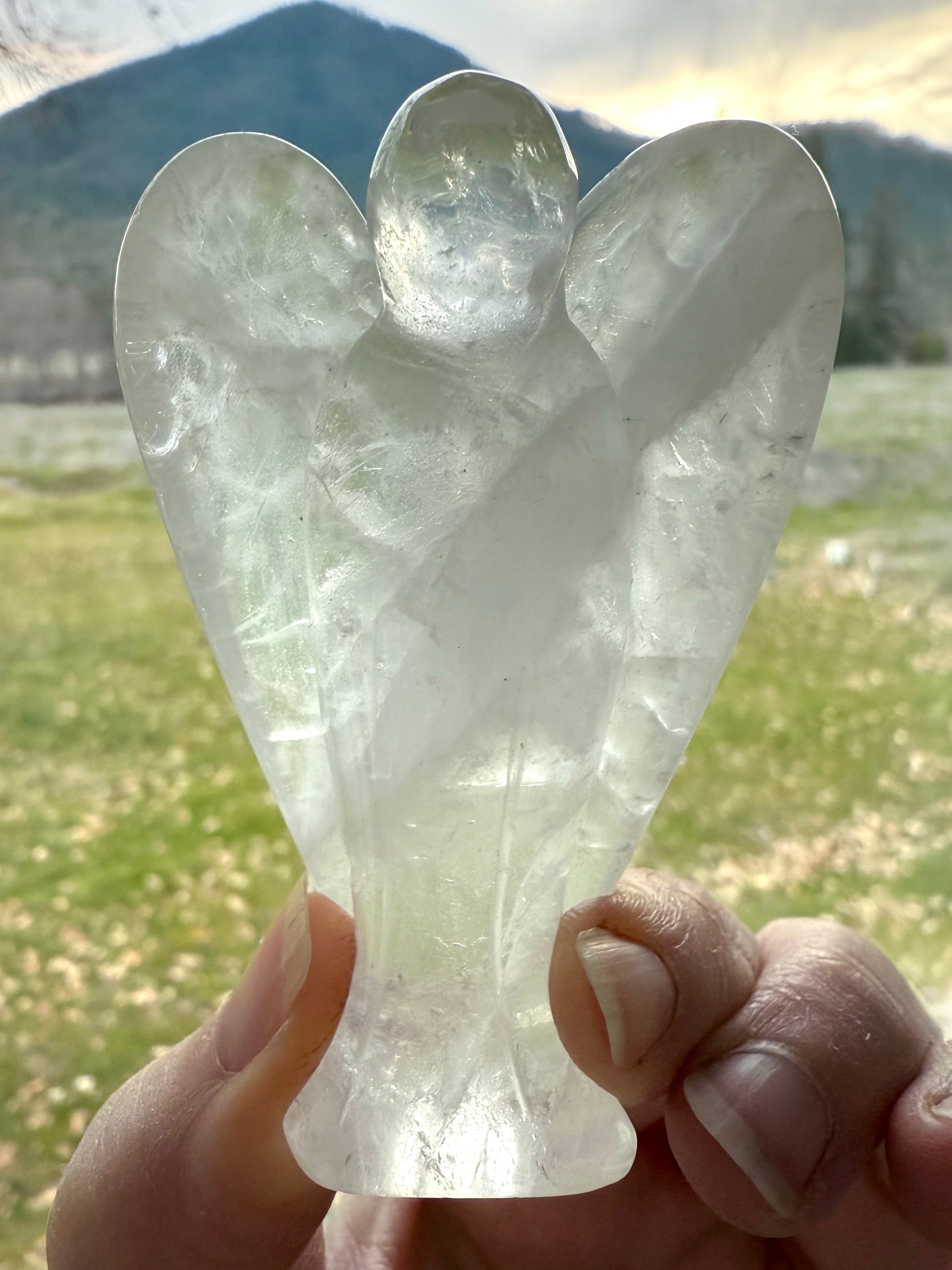 The crystal angel figurine has a beautiful natural zigzag pattern in the stone