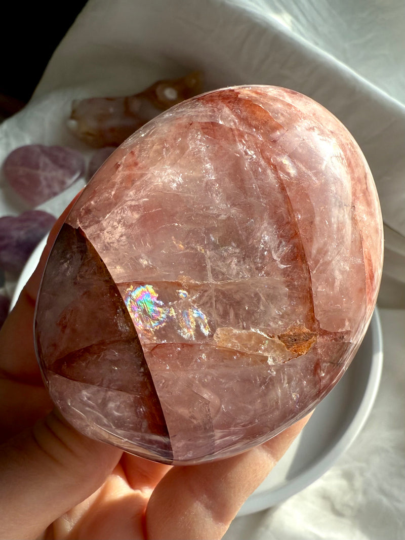 an extra large Fire Quartz Palmstone with rainbows