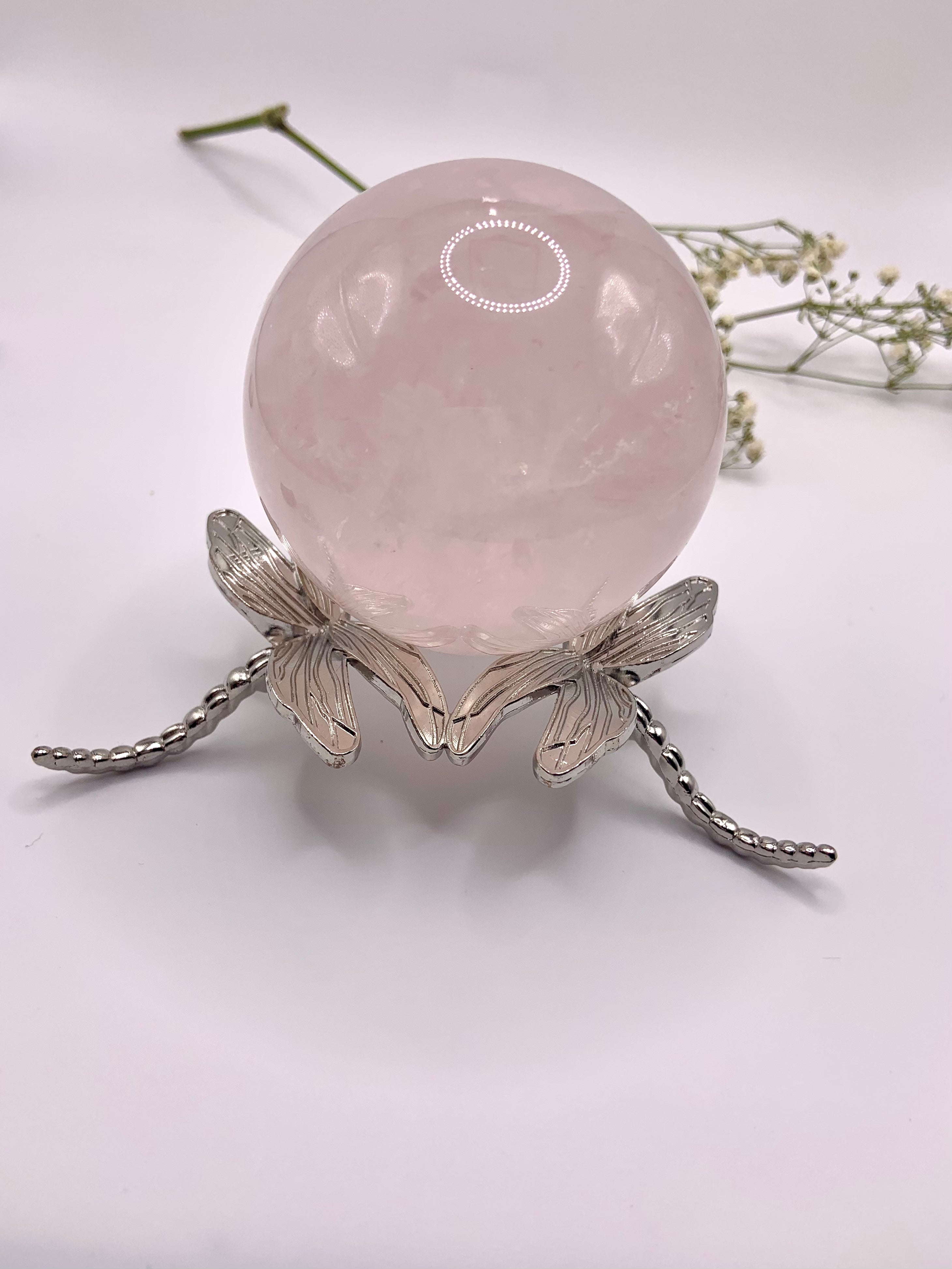 The larger dragonfly crystal sphere stand shown with a 60mm rose quartz sphere
