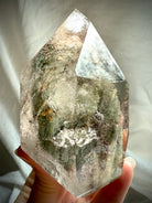 Lodolite phantom Garden Quartz crystal tower with layered mineral inclusions, Shaman’s Stone supporting Root, Heart, and Third Eye Chakras