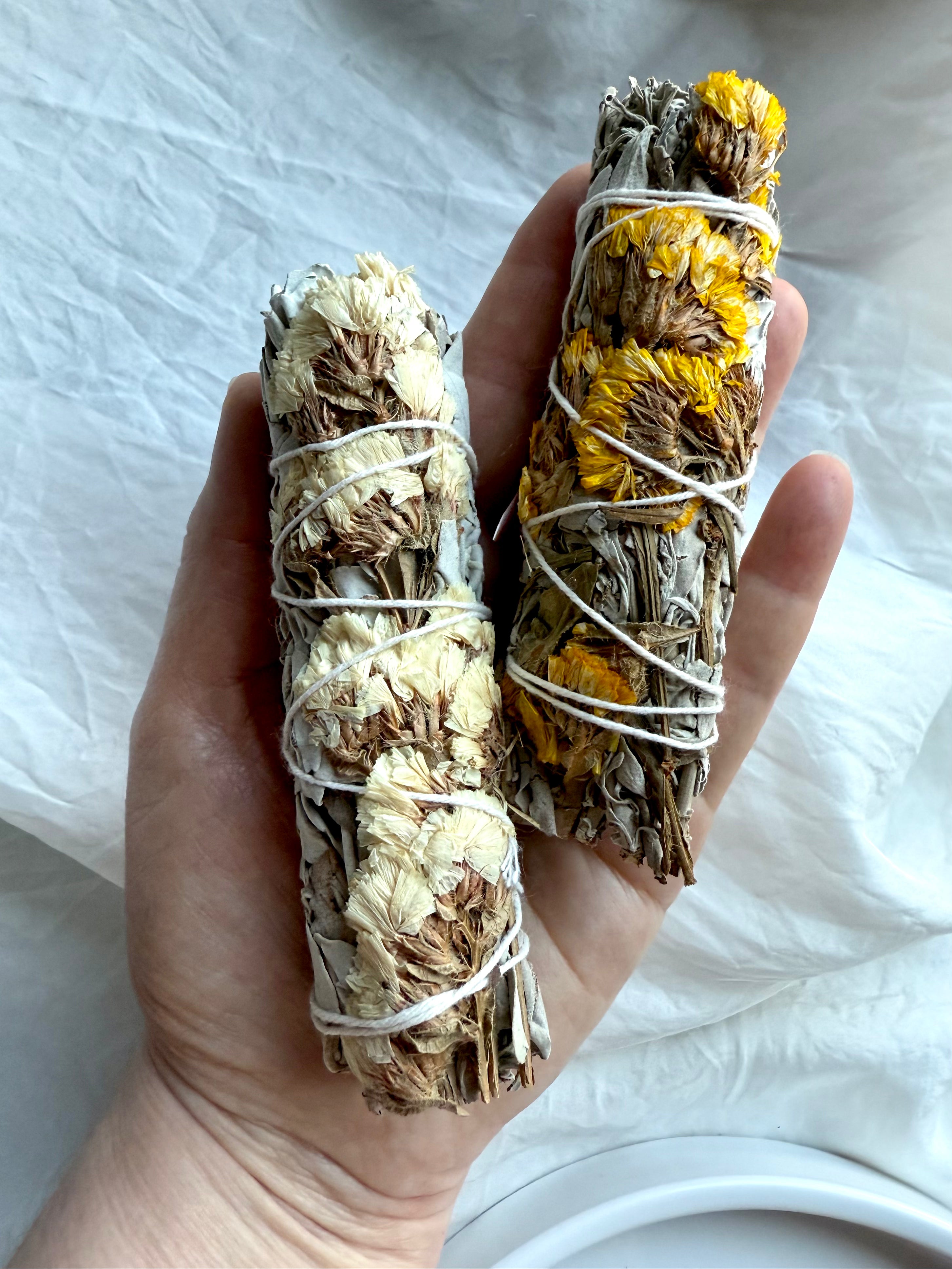 Yellow and white floral sage bundles for spiritual cleansing and crystal clearing rituals