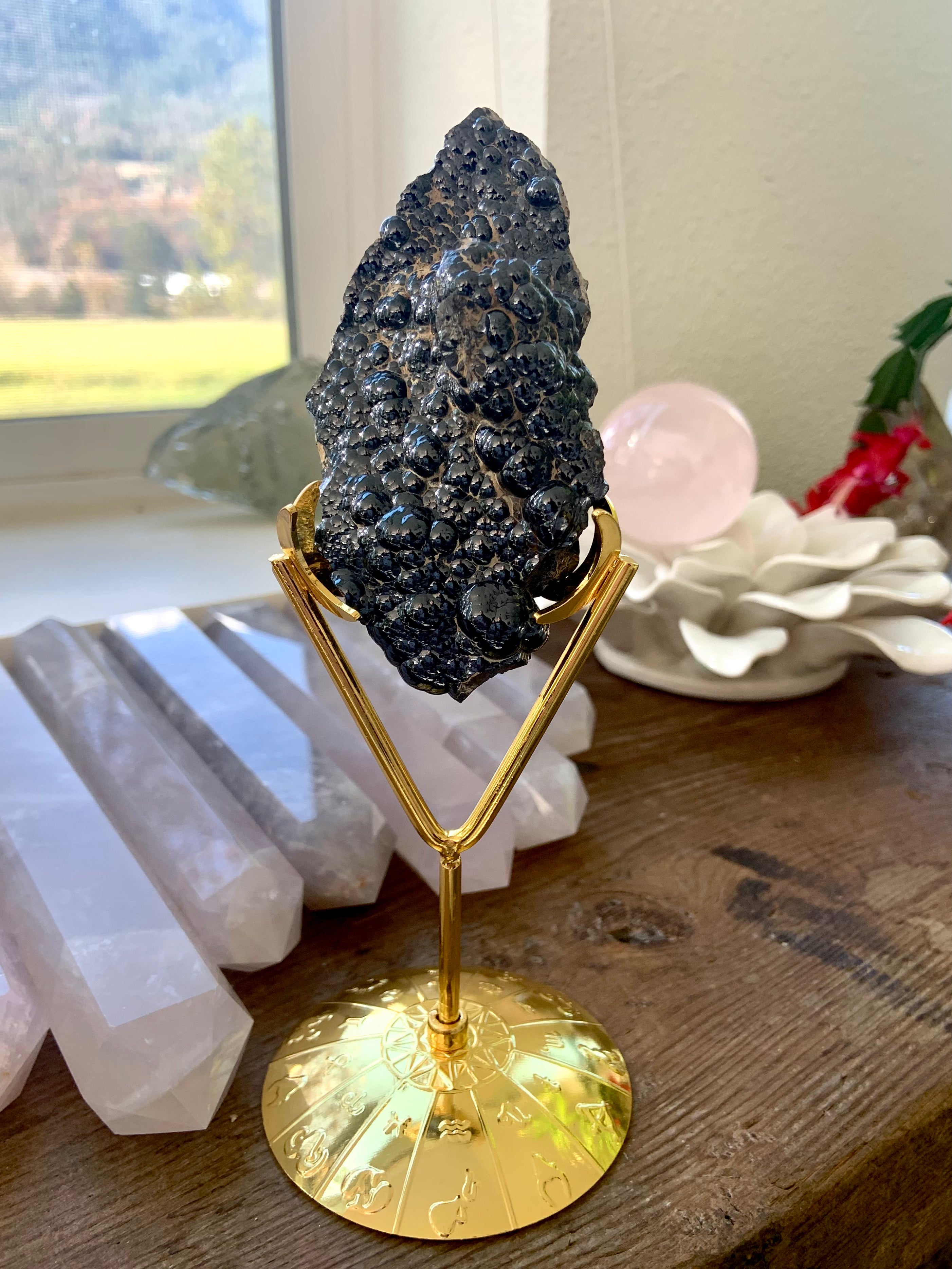 Zodiac wheel crystal display stand with botryoidal hematite specimen — versatile crystal decor stand for unique collector’s pieces.