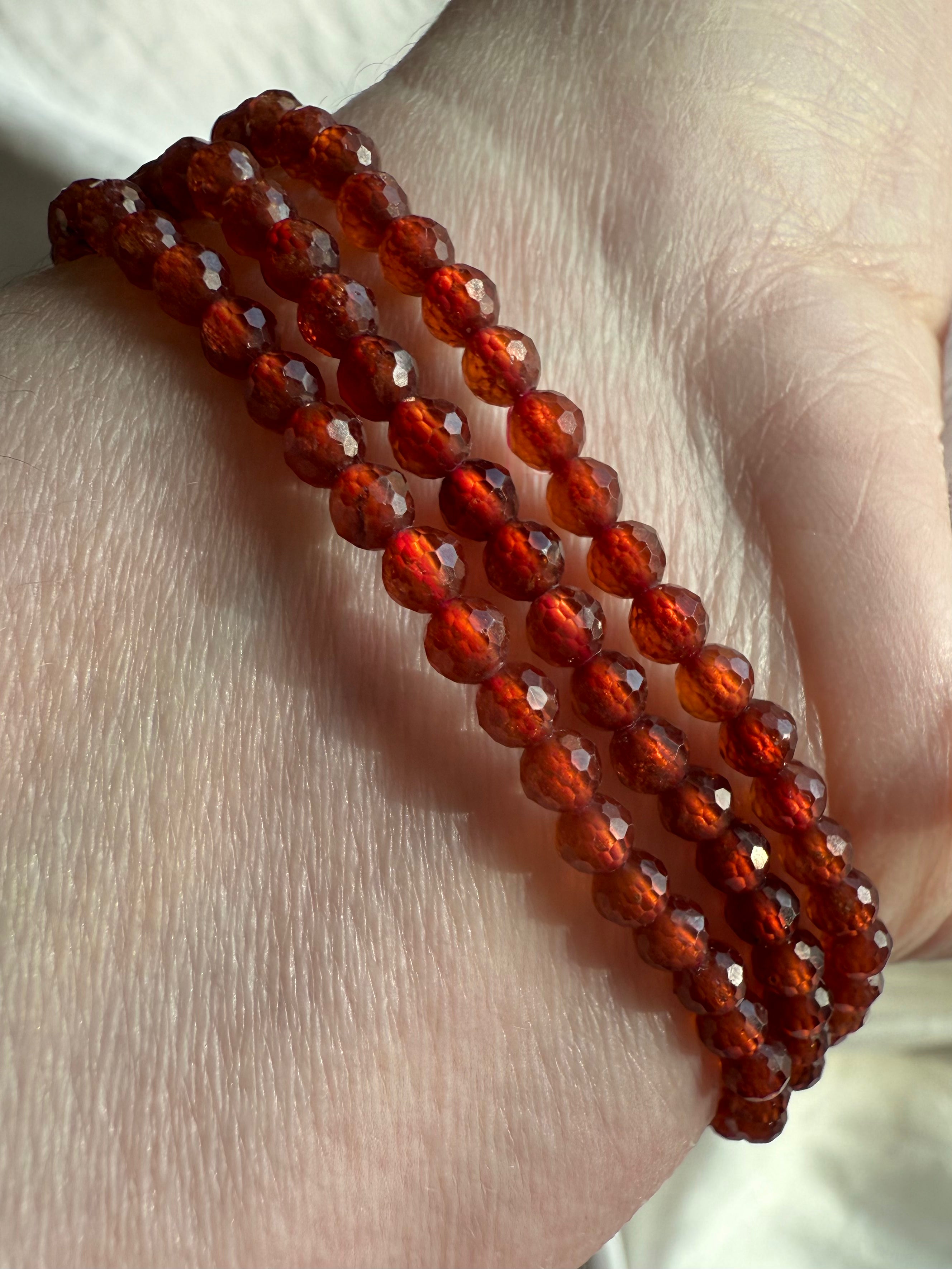 Our sparkly faceted Spessartite Garnets can be worn as a Wrap Bracelet or Necklace